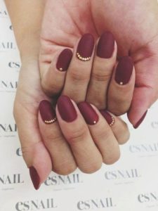 gold accents burgundy nails