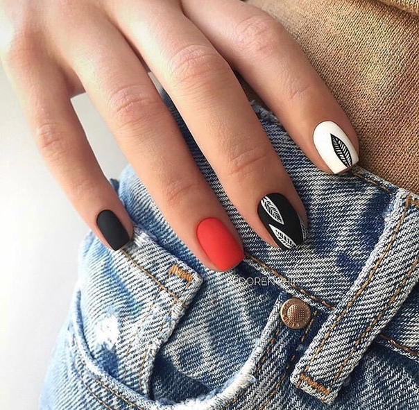 Black, red and white nails with feathers