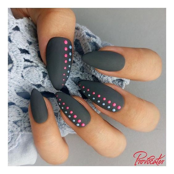 Gray nail design with light blue and pink dots