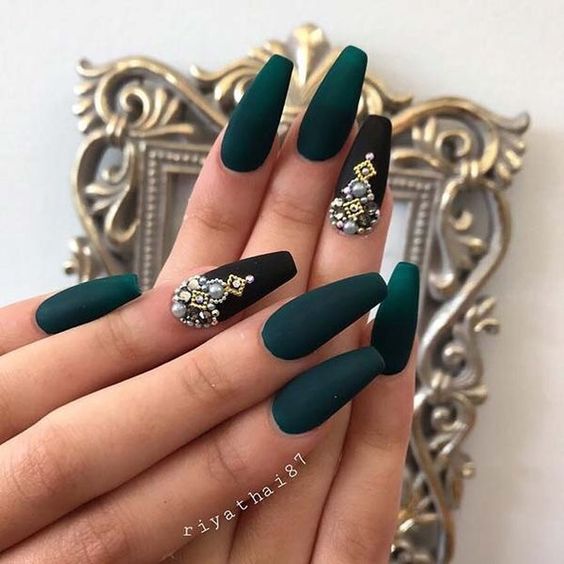 Green matte coffin shaped nails with embellishments 