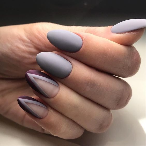 Purple and gray stiletto nails with negative space