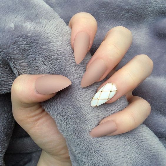 Nude stiletto nails with white accent nail