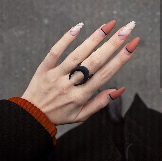 Marble ad orange nails with black details 