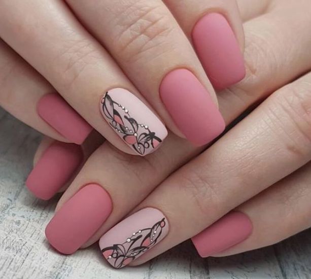 Matte pink short nails with a patter on the ring finer-nail  