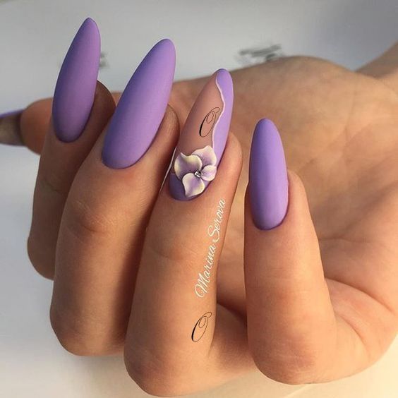 Lavender nail polish with flower pattern on almond shaped nails 