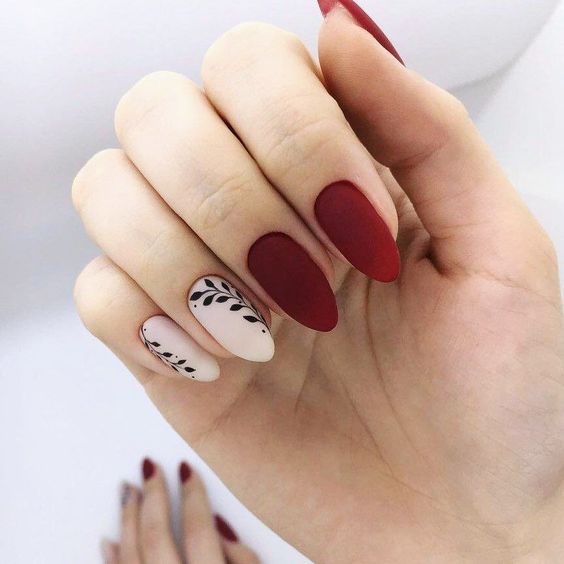 Red and white nail polish with matte finish