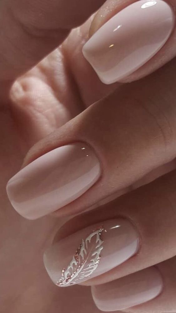 White feather on the ring finger nail