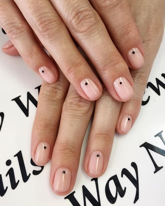 Spots at the centre of the nail bed over nude polish