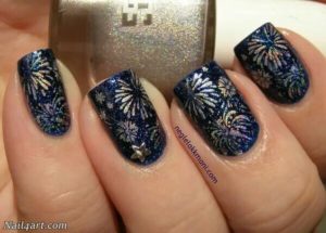 fireworks nail art on dark blue polish