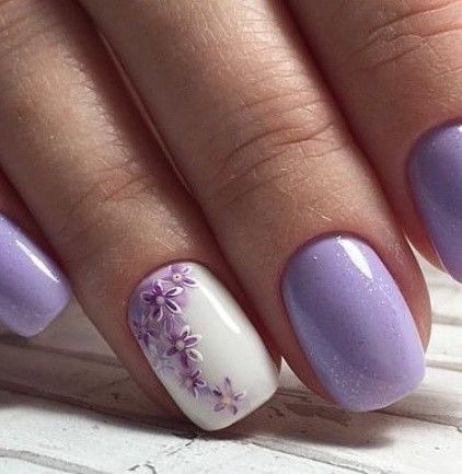 purple polish and purple flowers on accent nail