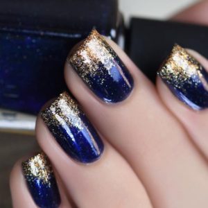 dark blue and gold glitter ombre nails