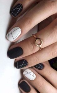 linear detail on black and white nails