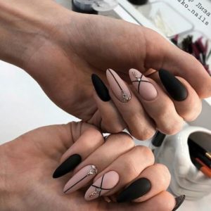 lines and gem details on nude and black nails