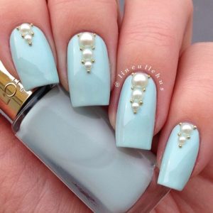 Baby blue nails with pearl decoration