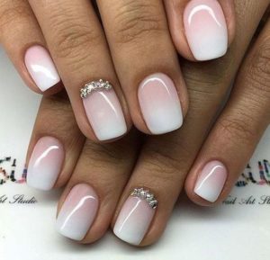 nude ombre nails with gems on accent nail