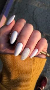 White nails with accented sparkly nail