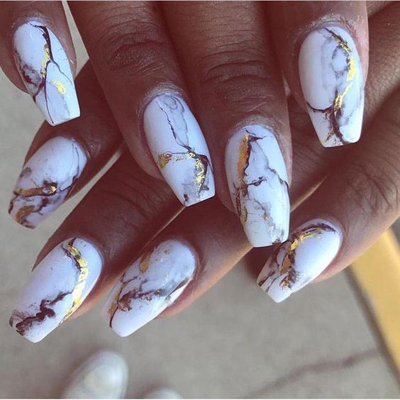 White and gold marble nail design