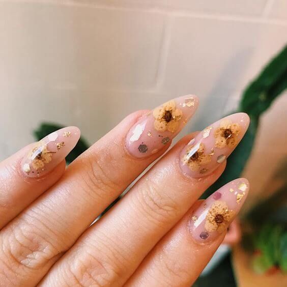 yellow flowers on nude nails