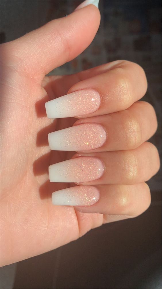 small gold glitter on french manicure nails