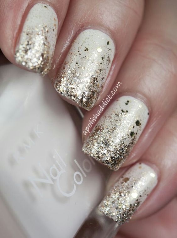 Gold glitter gradient from nail tips on white polish