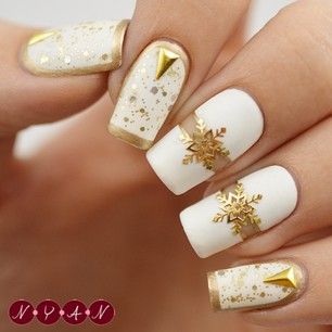 gold snowflakes on white base polish