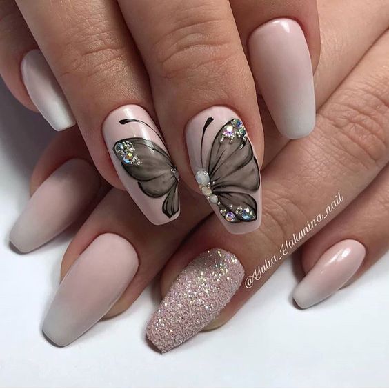 nude pink base and grey butterfly nail art over two nails