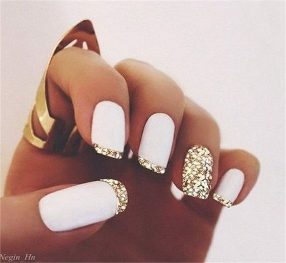 A white base polish and gold french manicure