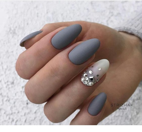Lighter grey accent nail with rhinestones