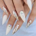 White stilettos nails with glitter