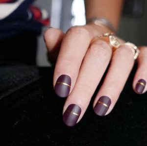 Burgundy Nails with a Gold Stripe