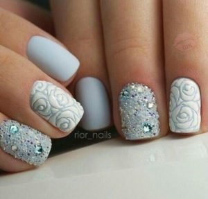 short blue nails with different patterns