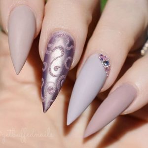 purple long stiletto nails with patterns