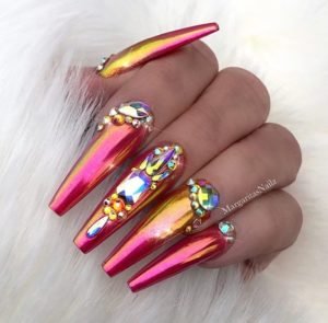 Pink and orange chrome nails with embellishment