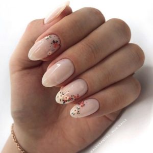 small floral art over pearl nude polish
