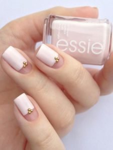three quarters nail painted with gold beads