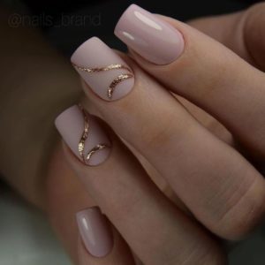 gold curvy lines on two nails