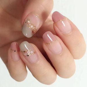 natural green and pink nail tips with shell edges