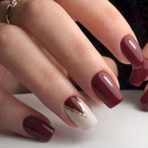 maroon nails with triangle nail art