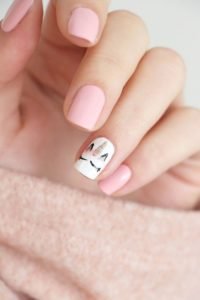 unicorn nail art on accent nail with pastel shades