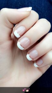 French manicure with a thin gold bottom lining