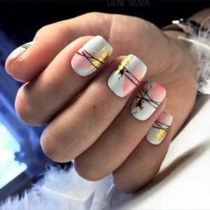 Blotches of nail foil and nail paint with lines crossing over