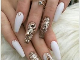 Gold stud stickers on white base polish