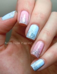 pink and blue nails with glitter polish on tips