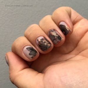 Parts of flower over gold nail foil