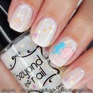 confetti glitter polish over white nail polish