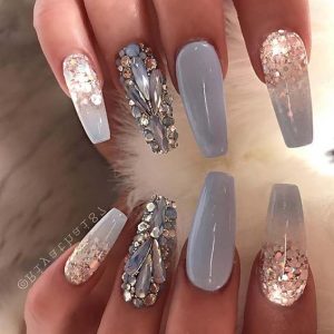 rhinestones and glitter polish to create a super sparkling look