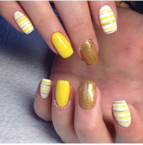 stripes nail art using different shades of yellow