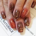 30. Gold Glitter and Brown Nails